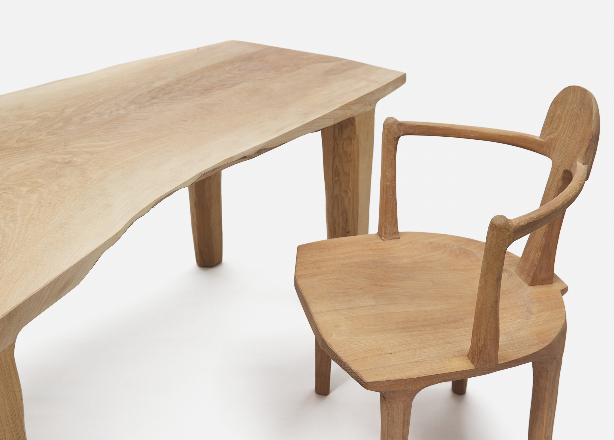 SASA Works, Umbwa Table, 2024, European Walnut and British Oak, h 75.5 × l 187 × d 97 cm; SASA Works, Babu Chair, 2023, Scottish Wych Elm, h 89 (seat h 45) × w 60 × d 58 cm